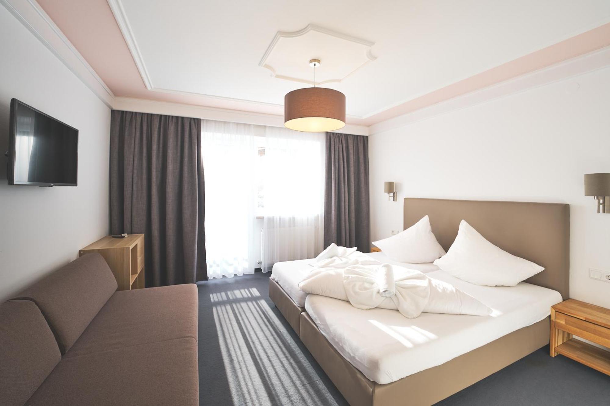 Dreibettzimmer mit Balkon